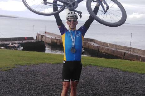 Cyclist at John O'Groats