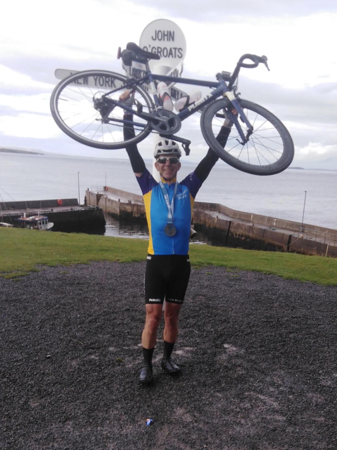 Cyclist at John O'Groats